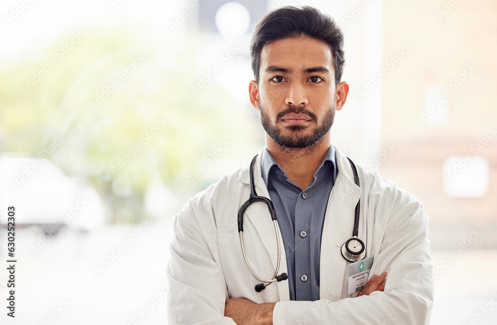 Arms crossed, serious and man doctor portrait in hospital with stethoscope, attitude and determined 