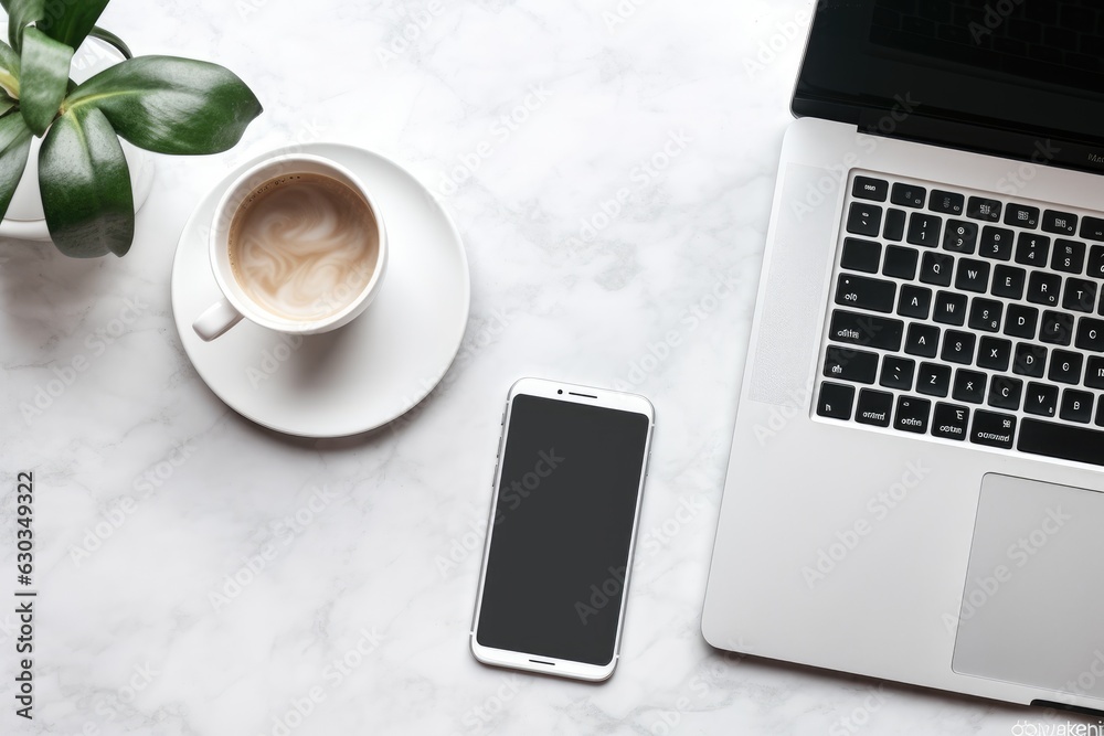 Top view of an cell phone, computer and mug with coffee