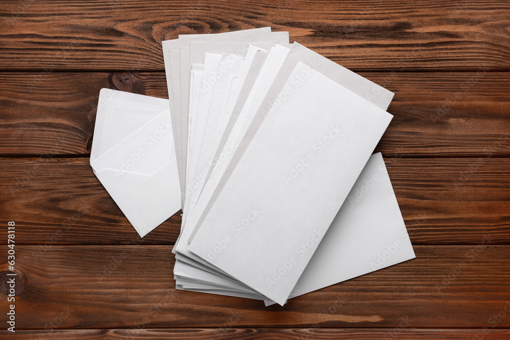 Stack of letters on wooden background