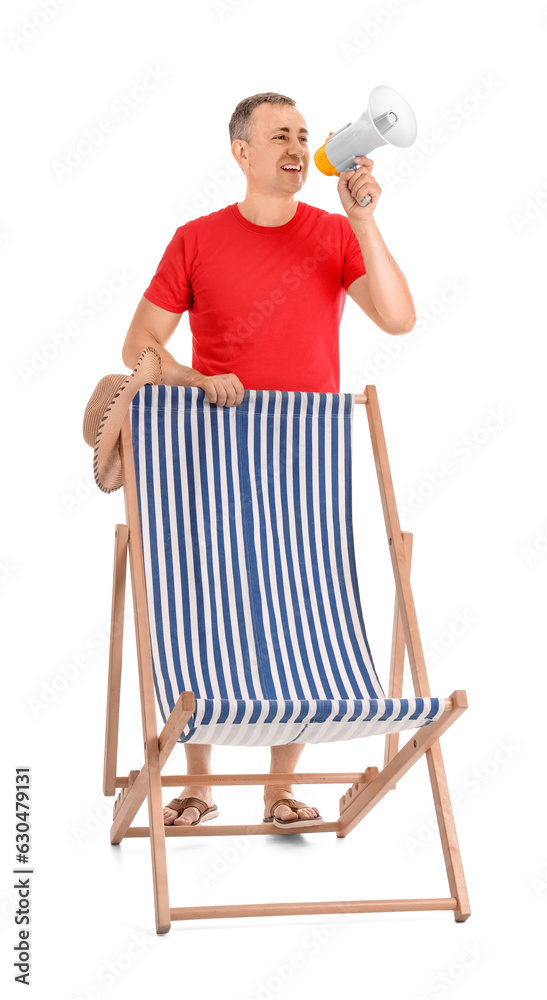 Mature man shouting into megaphone and deck chair on white background