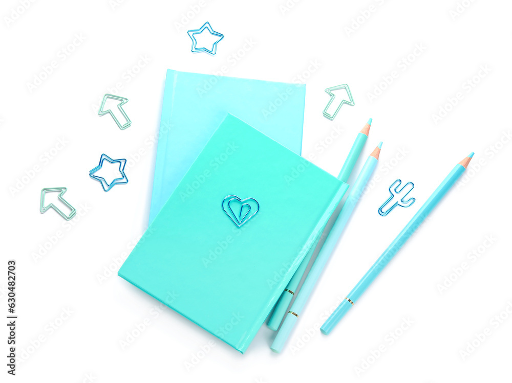 Notebooks and school stationery on white background