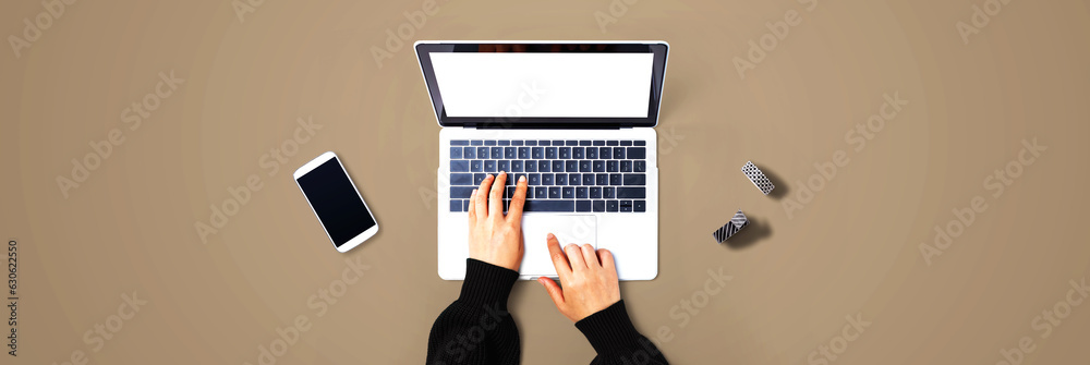 Person using a laptop computer from above