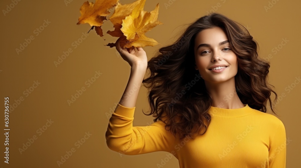 Beautiful girl with autumn leaves