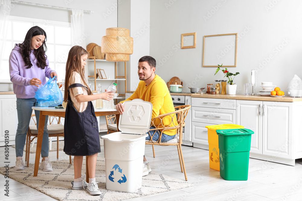 Family sorting plastic garbage with recycle bin in kitchen