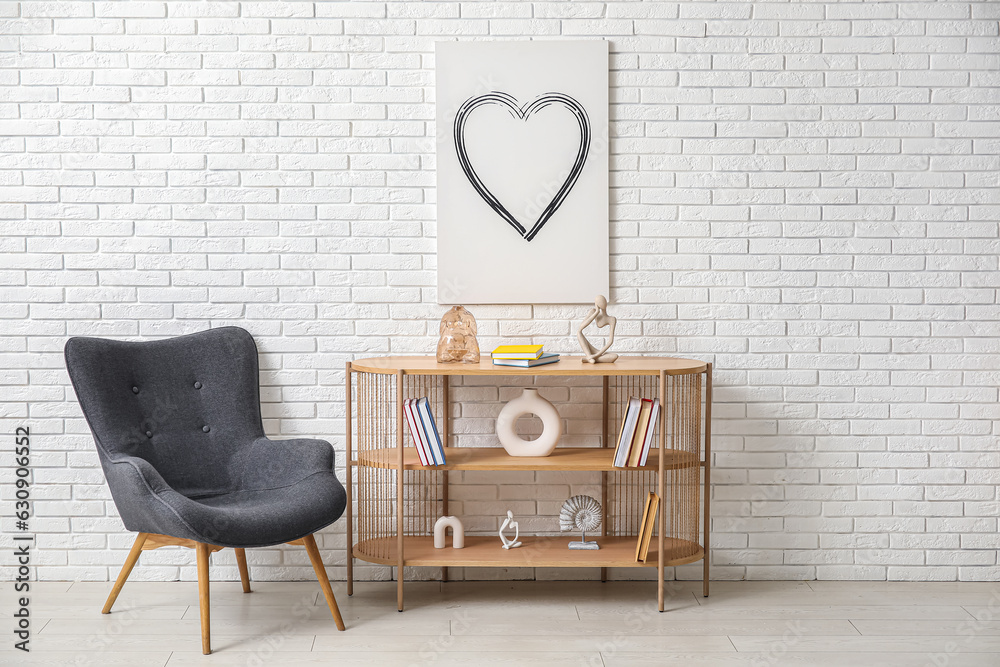 Interior of living room with bookshelf and armchair