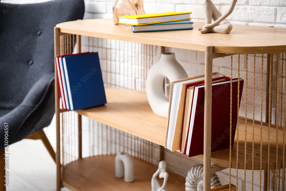 Bookshelf with decor in living room, closeup