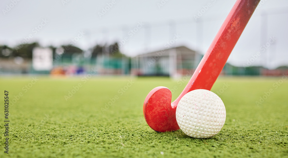 Field, sports and a ball and a stick for hockey, fitness and training in the morning. Closeup, groun