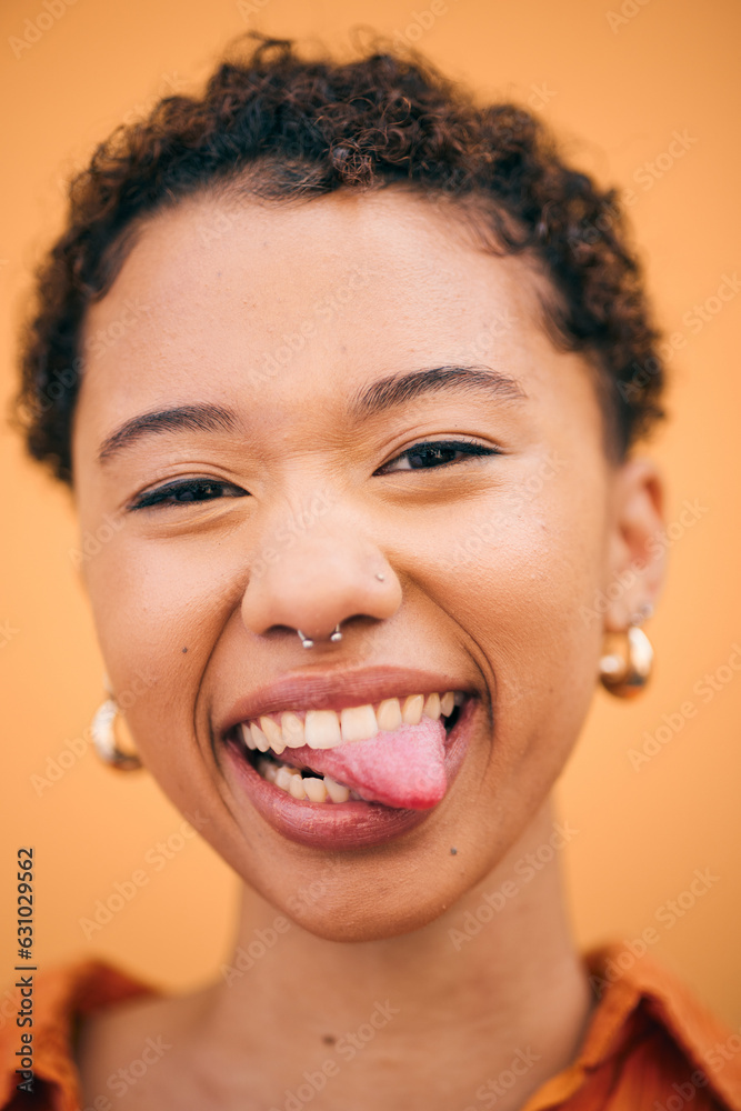 Happy, woman and tongue out portrait in studio with smile and confidence feeling silly. Orange backg