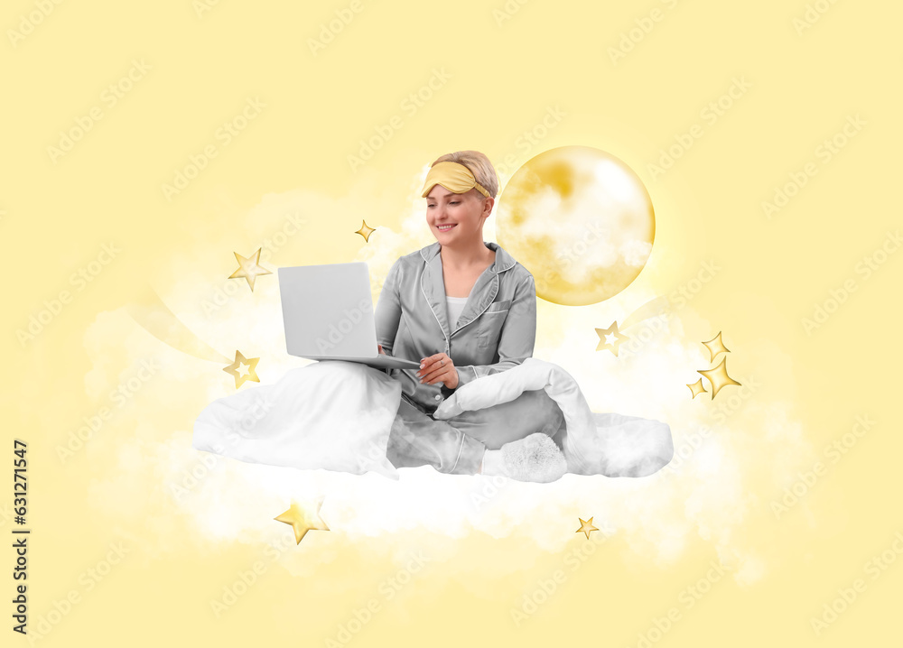 Young woman with sleeping mask, blanket and laptop sitting on soft cloud against light yellow backgr