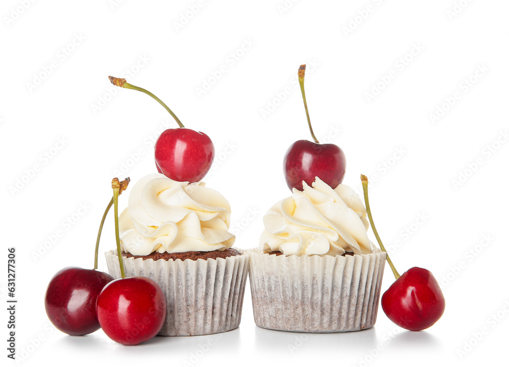 Tasty cherry cupcakes on white background