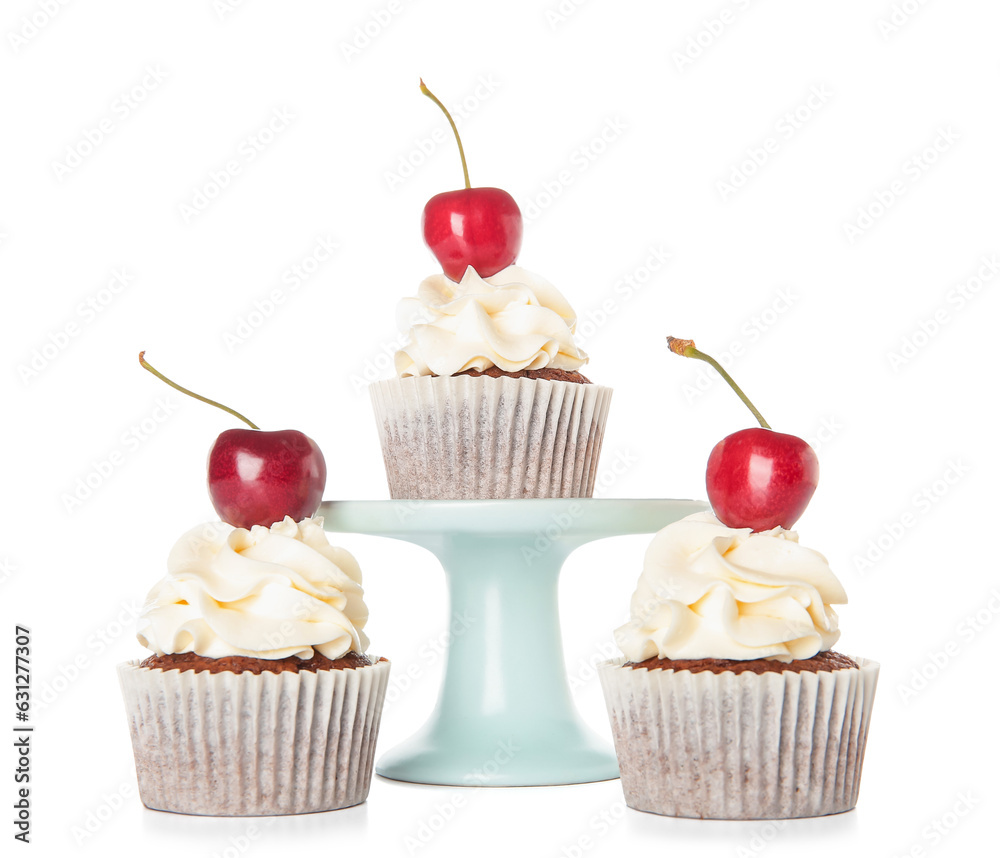 Stand with tasty cherry cupcakes on white background