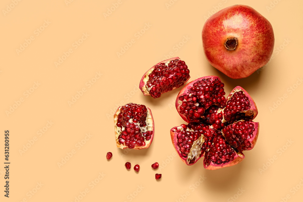 Fresh pomegranates on yellow background