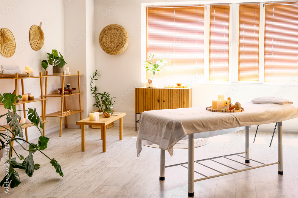 Interior of modern spa salon with burning candles