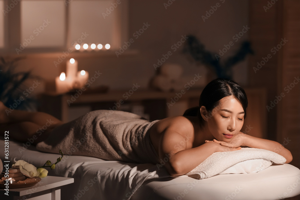 Pretty young Asian woman in spa salon