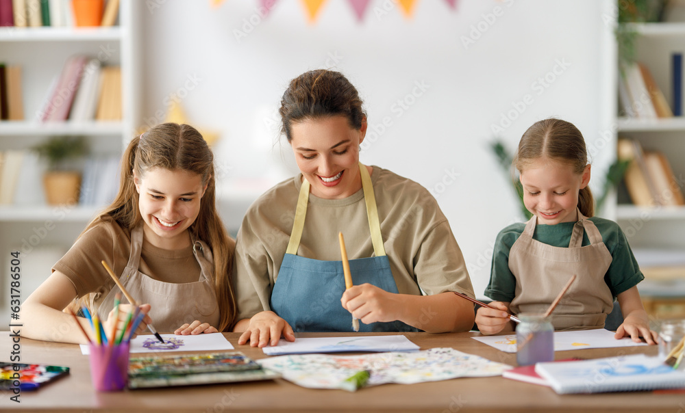 kids and teacher at the art class