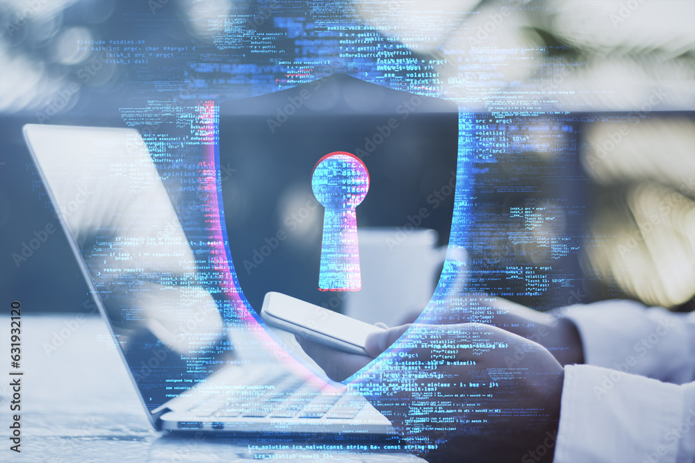 Close up and side view of male hands using laptop computer and cellphone at desk with creative digit