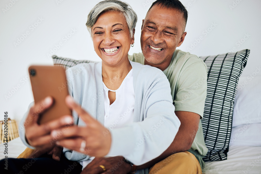 Mature, happy couple and selfie in bed at home with smile, retirement and marriage. House, mobile an