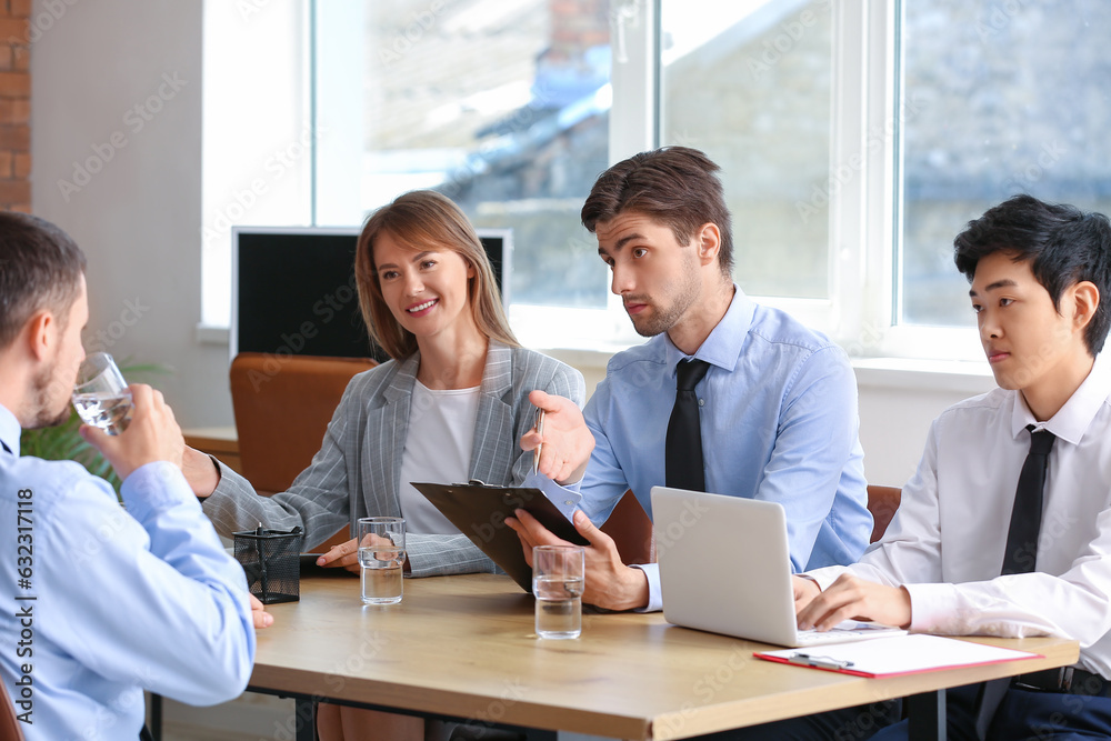 Human resources commission interviewing male applicant in office