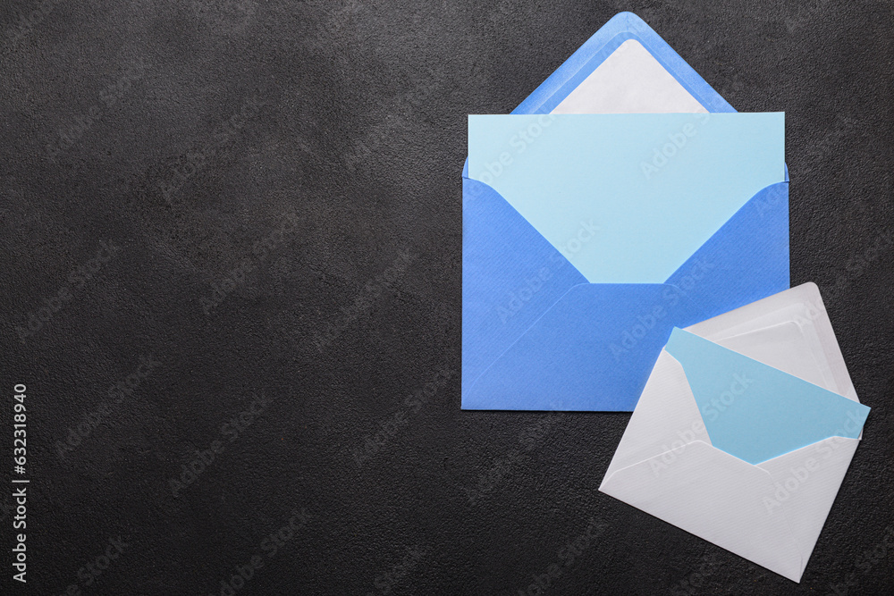 Envelopes with blank cards on dark background