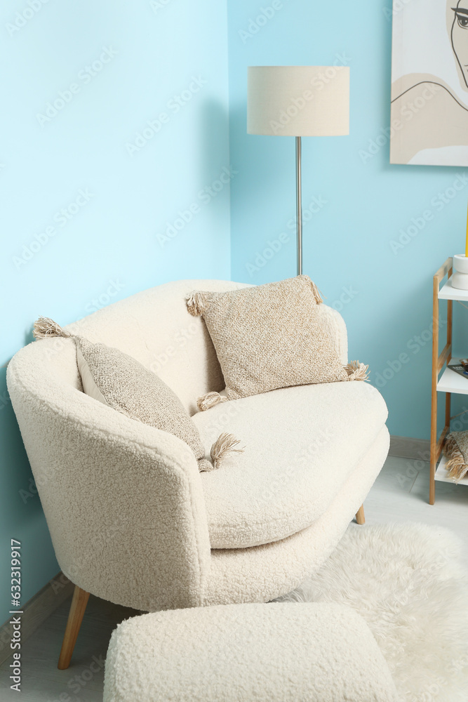 Modern living room interior with white sofa and ottoman