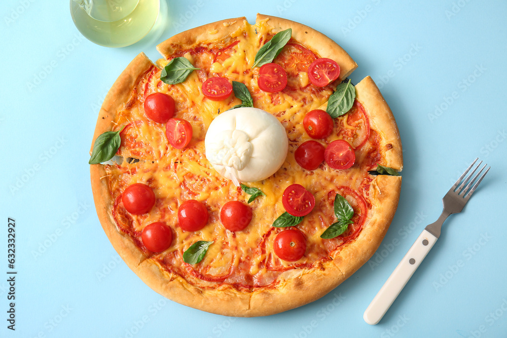 Tasty pizza with Burrata cheese on blue background