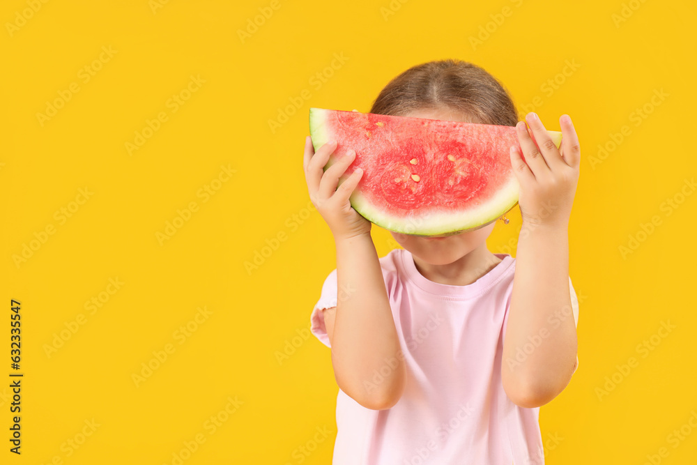 Little girl with slice of fresh watermelon on yellow background