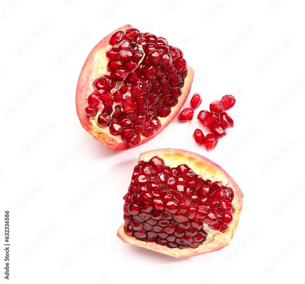 Pieces of fresh pomegranate with seeds on white background