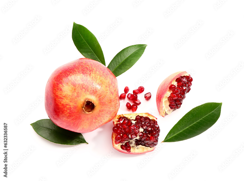 Fresh pomegranates and leaves on white background