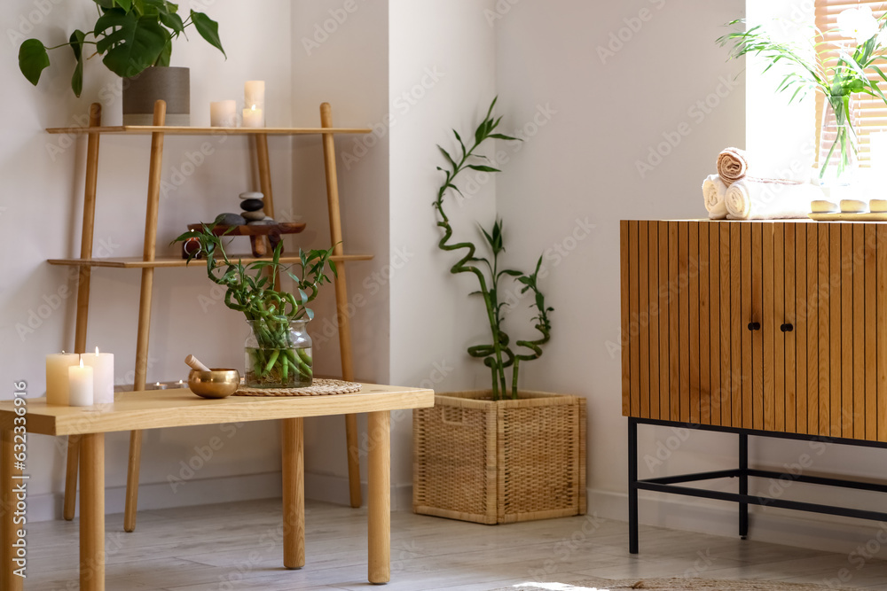 Interior of modern spa salon with burning candles