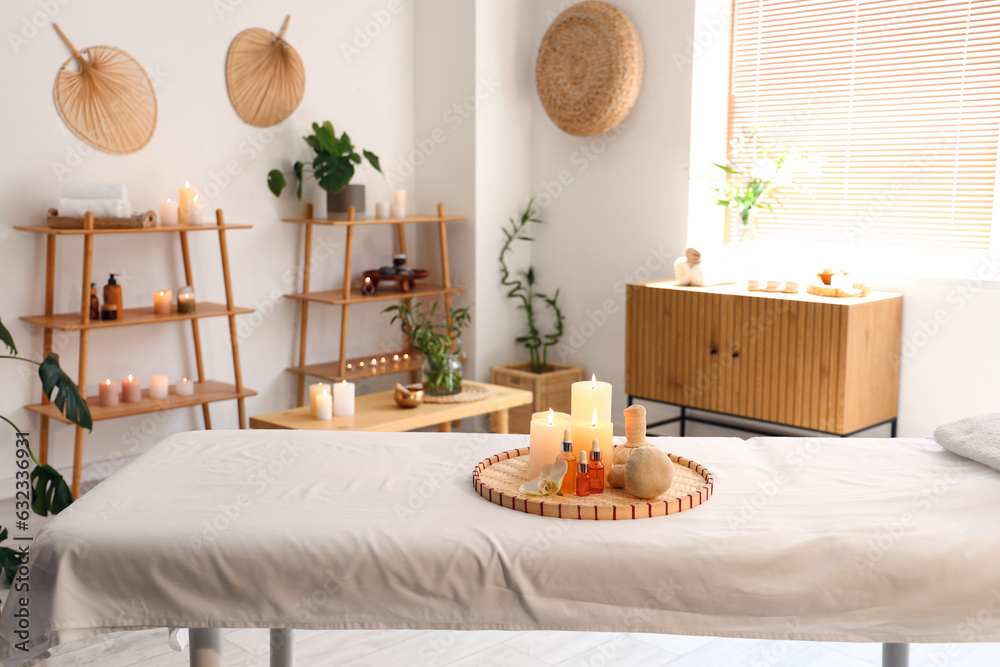 Interior of modern spa salon with burning candles