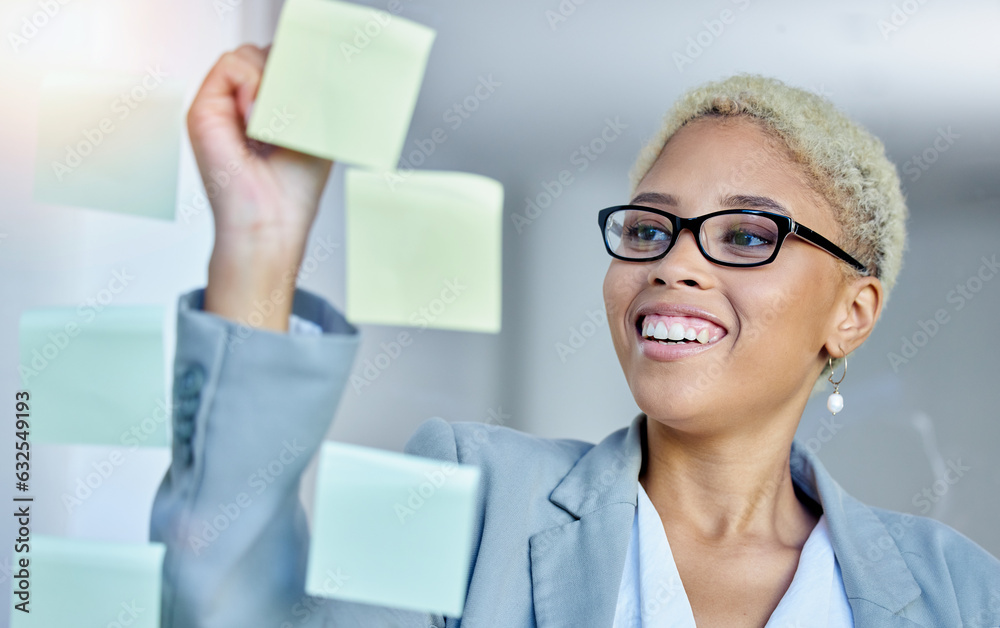 Writing, planning and happy business woman in office with sticky note goal, idea or strategy. Schedu