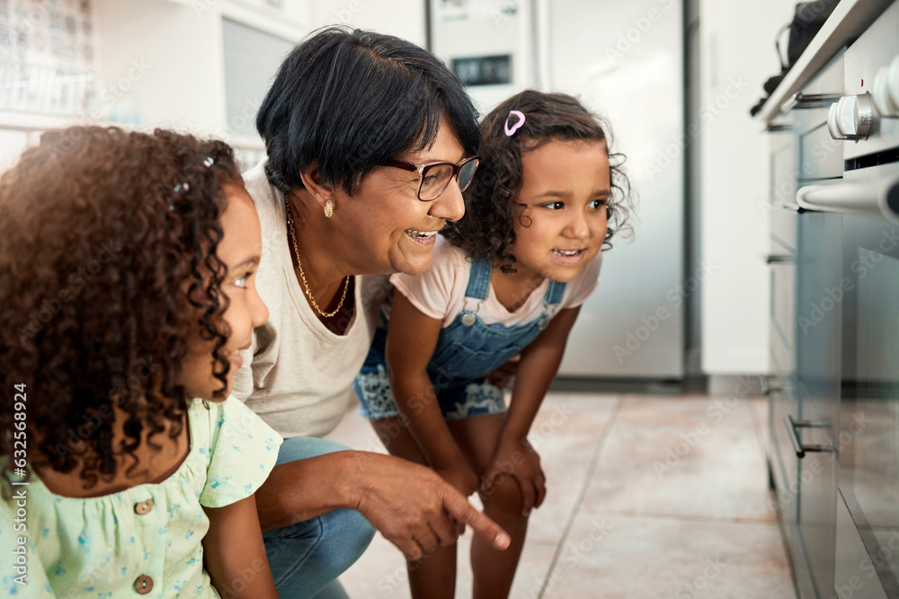 Baking, oven and a senior woman with her grandchildren in the kitchen of a home together for cooking