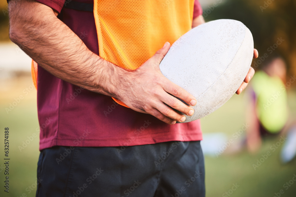 Rugby, man and hands with ball for outdoor games, competition and contest on field. Closeup of athle