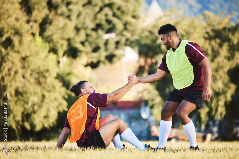 Rugby, teamwork and a sports man helping a friend while training together on a stadium field for fit