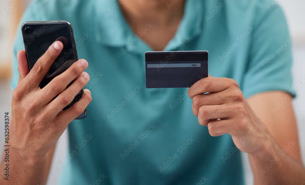 Hands, credit card and smartphone, man is online shopping and fintech with payment and discount on s