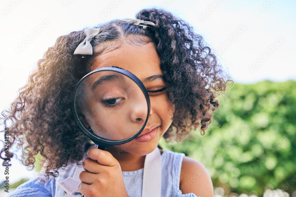 Girl child, magnifying glass and inspection in garden, backyard or park in science, study or outdoor