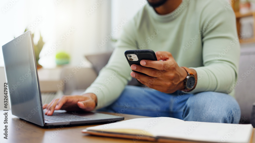 Phone, laptop and man hands typing while doing research for a freelance project in his living room. 