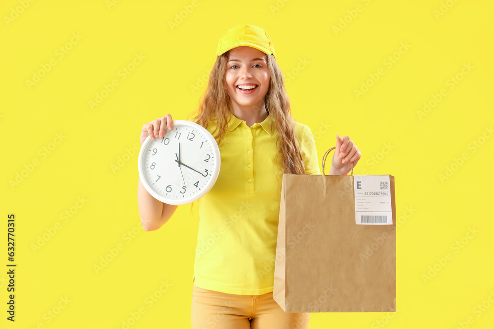 Female courier with paper bag and clock on yellow background