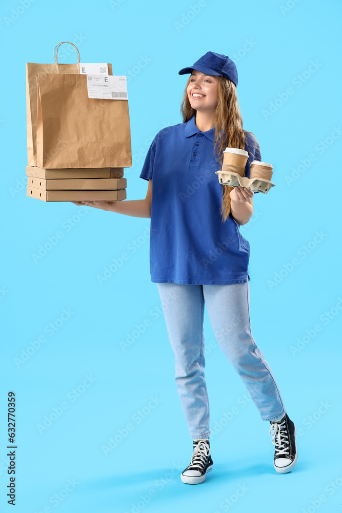 Female courier with food and drinks on blue background