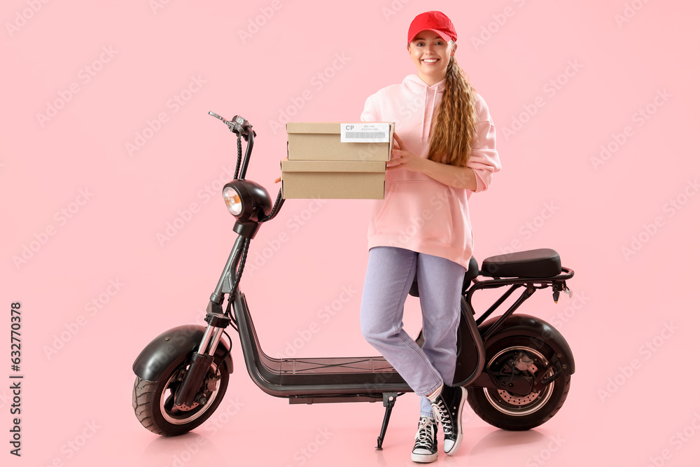 Female courier with parcels and scooter on pink background