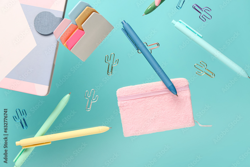 Flying school supplies on color background