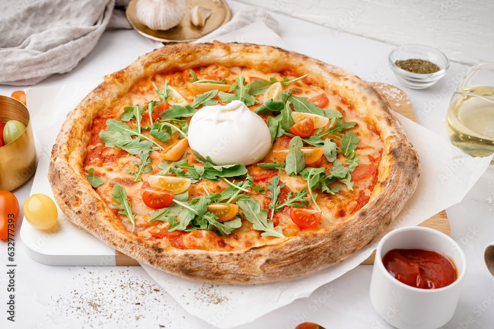 Tasty pizza with Burrata cheese on white background