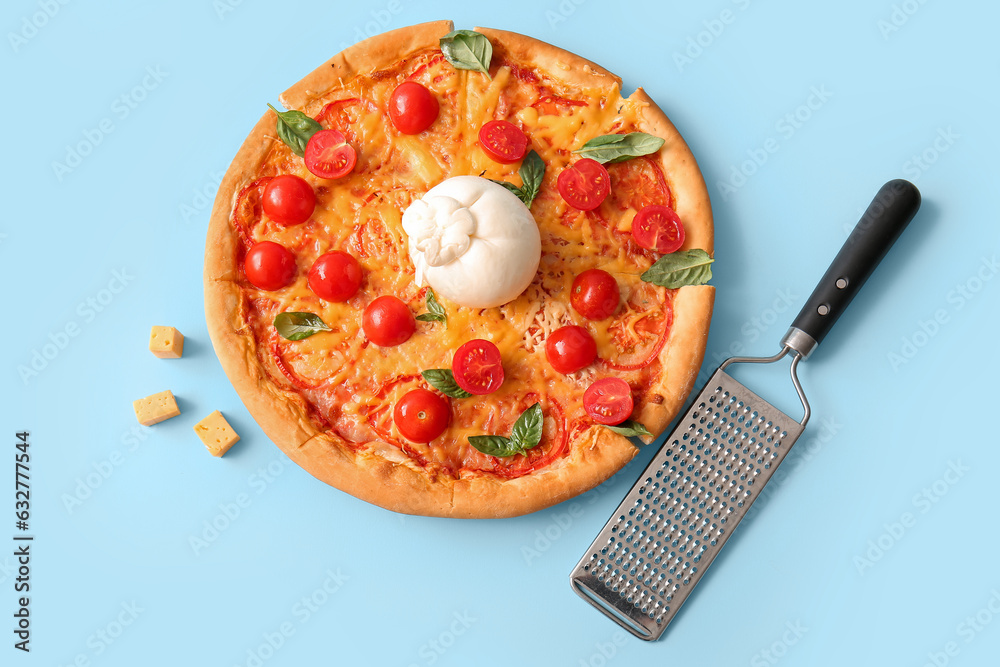 Tasty pizza with Burrata cheese on blue background