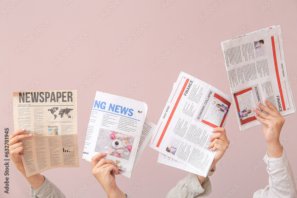 Female hands with different newspapers on color background