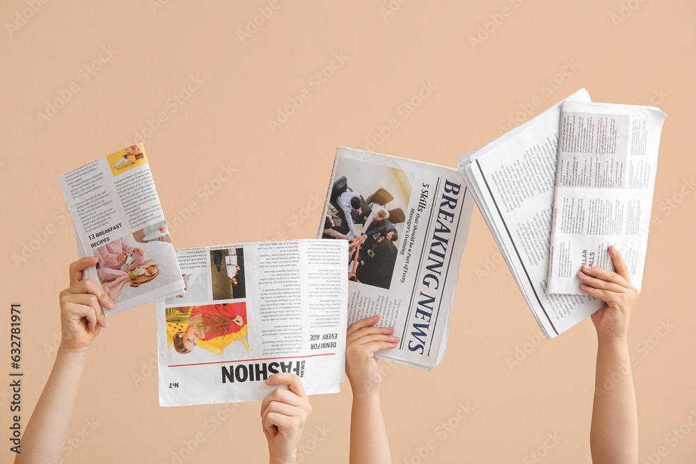 Female hands with different newspapers on color background