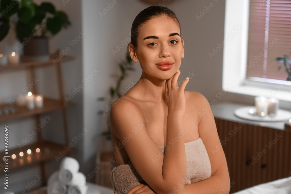 Portrait of pretty young woman in spa salon