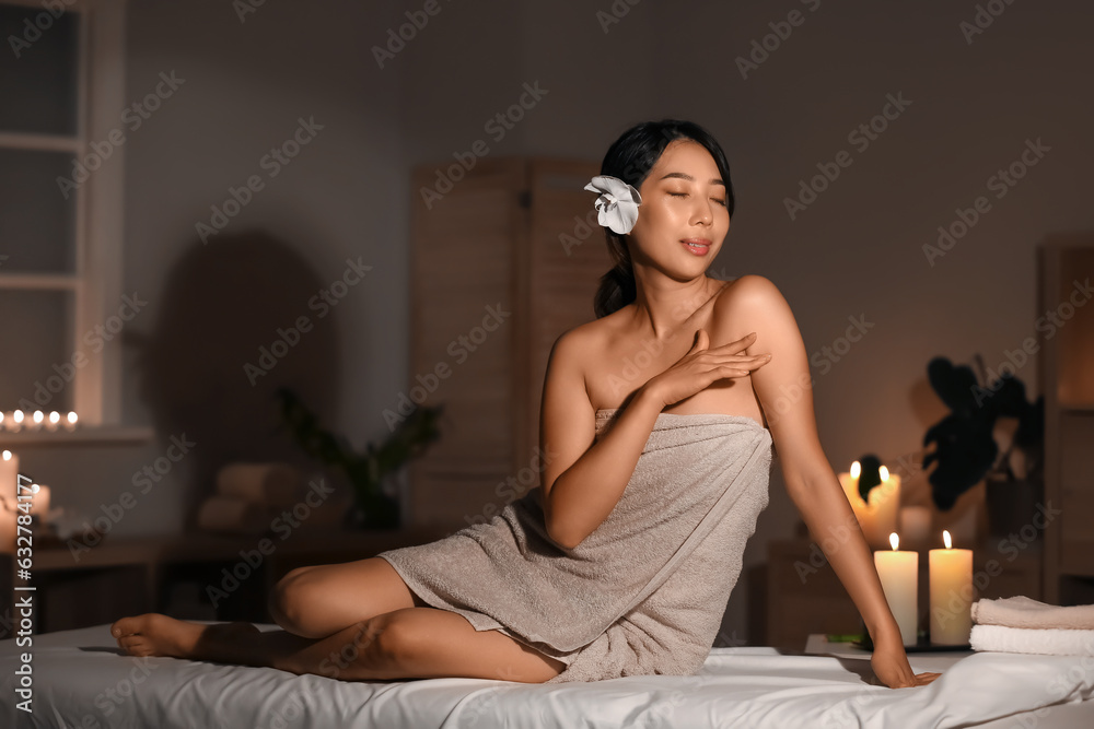 Portrait of pretty young Asian woman in spa salon