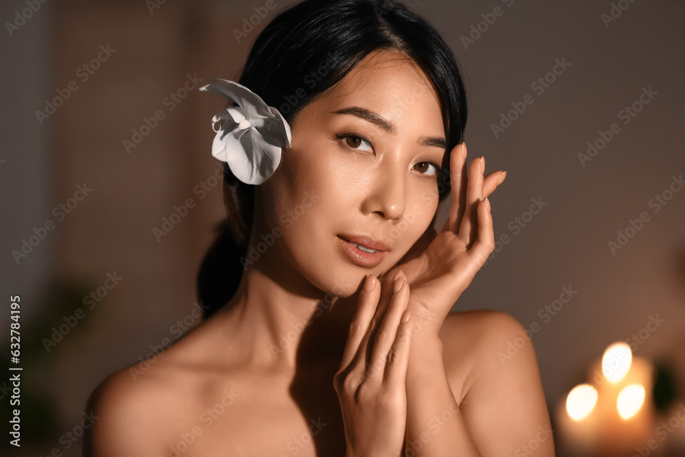 Portrait of pretty young Asian woman in spa salon