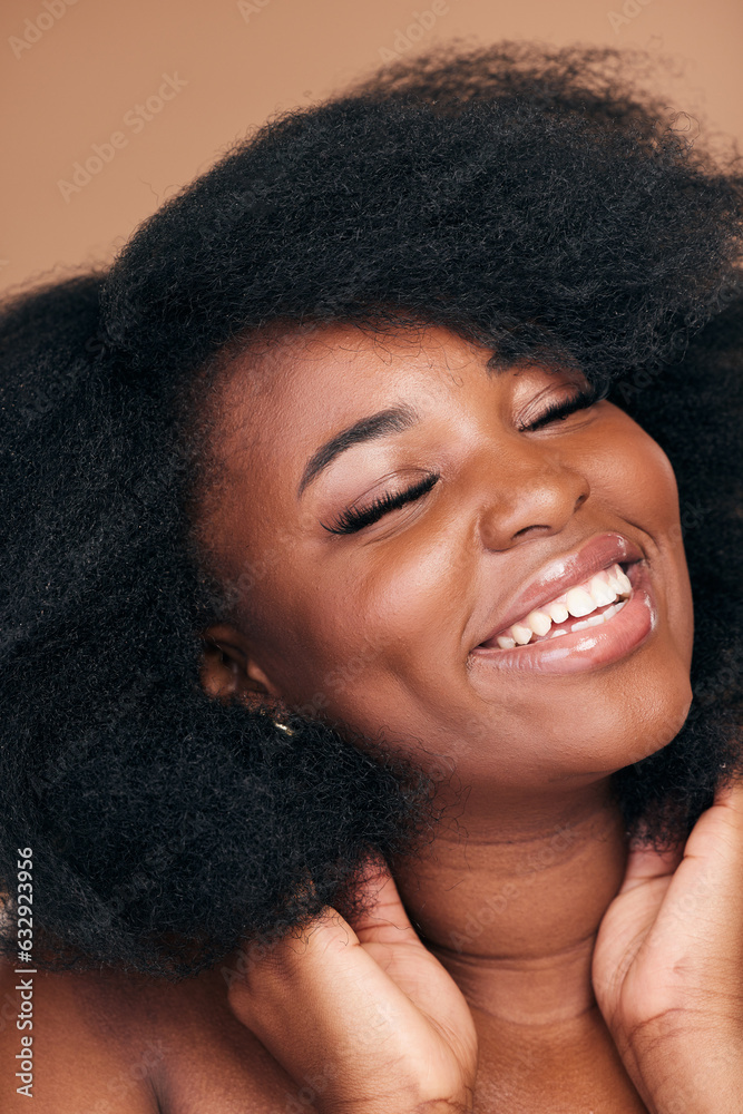 Smile, black woman and hair care for afro, beauty and cosmetics on a brown studio background. Growth