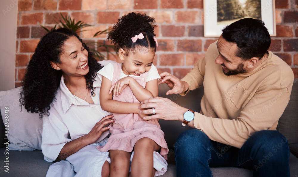 Family, happy and laughing while playing on a home sofa with tickle fun, bonding and time together. 